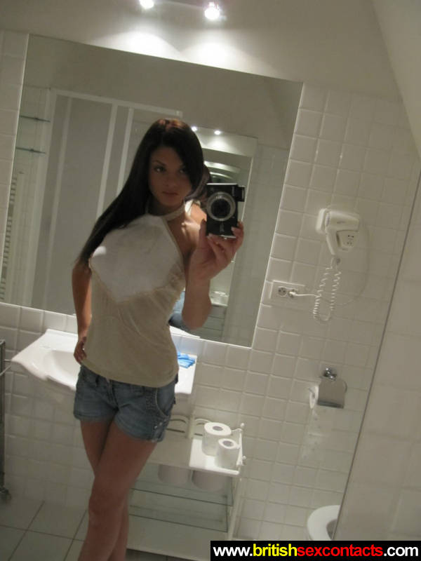 Very sexy babe taking selfies in the bathroom